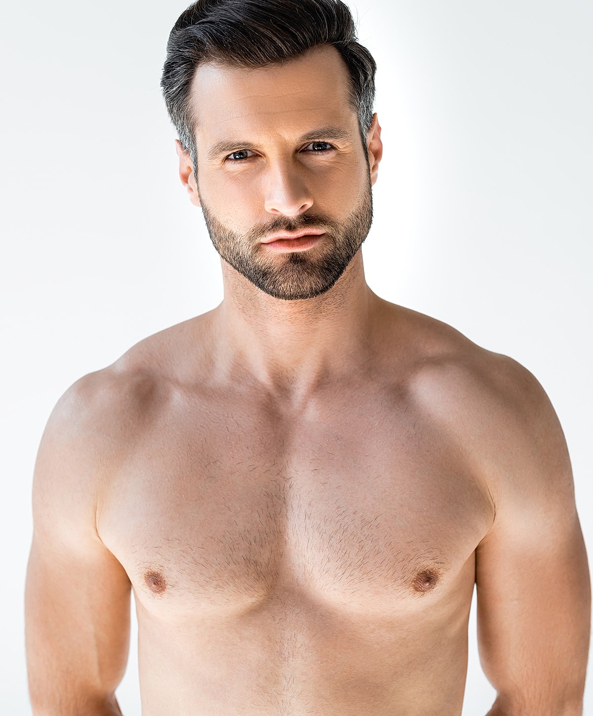 Man with a well-groomed beard and strong build.