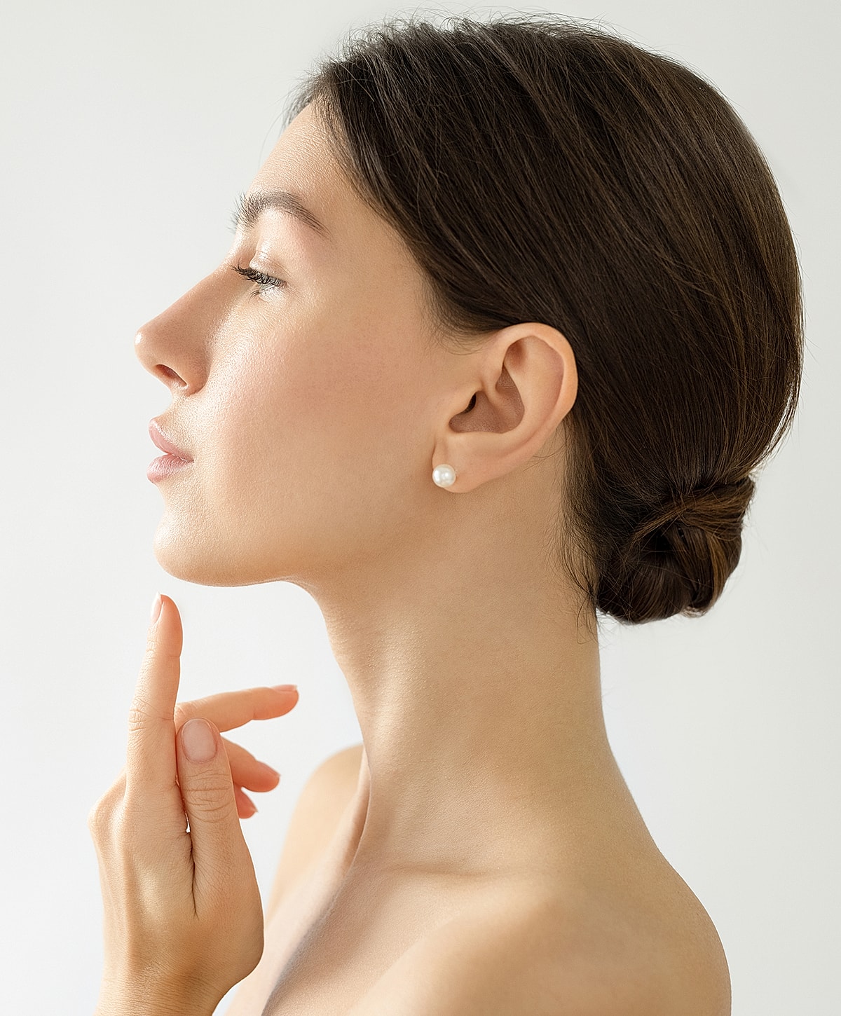 Profile of a woman with elegant hairstyle.